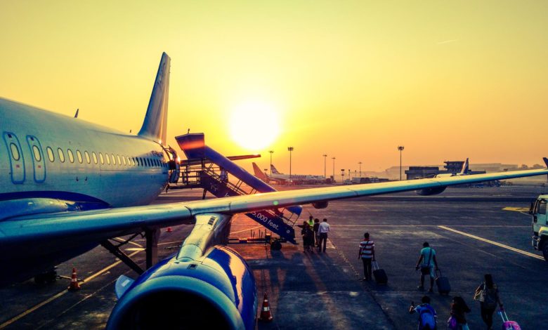 photography of airplane during sunrise