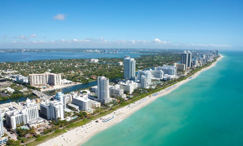 aerial view of city buildings near body of water